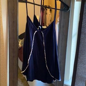 Navy and white accented tans top